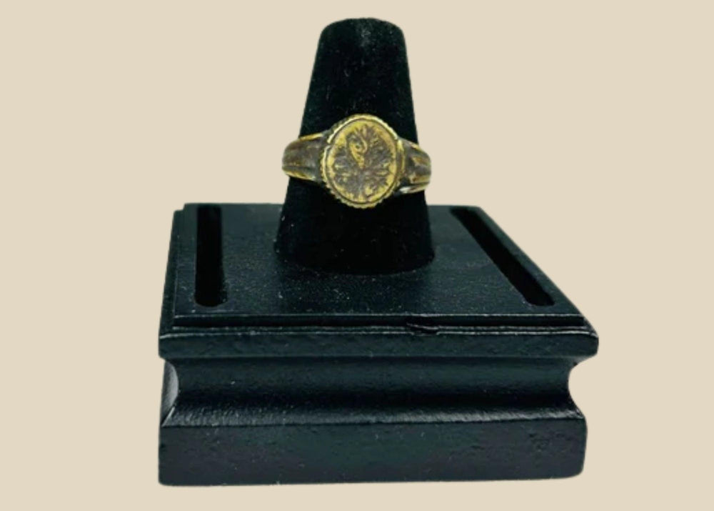 Late Roman to Early Byzantine gold-gilded bronze ring, circa 300–600 CE, with engraved floral bezel, worn gilding, and authentic patina.