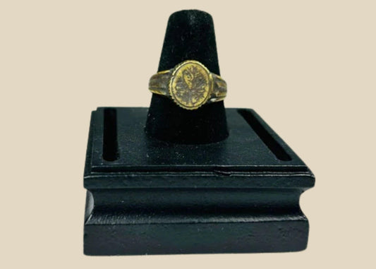 Late Roman to Early Byzantine gold-gilded bronze ring, circa 300–600 CE, with engraved floral bezel, worn gilding, and authentic patina.
