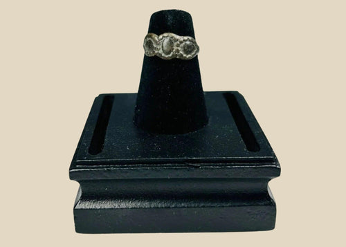 Ancient Late Roman–Byzantine silver ring featuring a clustered bezel of three oval motifs with natural aged patina, circa 300–600 CE.