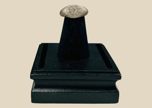 Ancient silver signet ring with finely engraved sunburst motif on bezel, thin rounded band, and natural aged patina, dating to the Late Roman to Early Byzantine period, circa 200–500 CE.