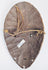 Hand-carved Lega Bwami society passport mask with original suspension holes and aged patina.