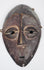 Authentic Lega passport mask featuring elongated facial form and stylized almond-shaped eyes.