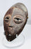 African tribal Lega mask associated with the Bwami initiatory society and personal status symbolism.