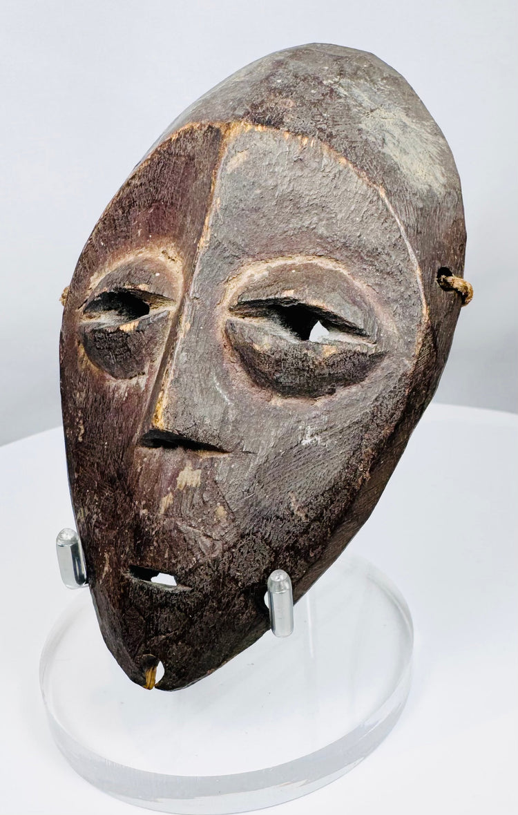 African tribal Lega mask associated with the Bwami initiatory society and personal status symbolism.