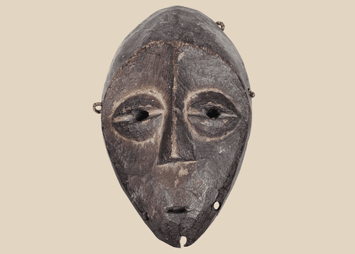 Lega passport mask carved from wood with dark ritual patina, Democratic Republic of the Congo, mid-20th century.