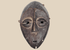 Lega passport mask carved from wood with dark ritual patina, Democratic Republic of the Congo, mid-20th century.