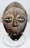 Wooden Lega devotional mask from the Democratic Republic of the Congo with rich dark patina.