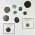 Ancient Roman coin reverse depicting symbolic imperial figure and archaeological surface texture