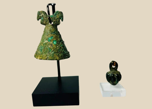 Ancient Luristan pendant bell from modern-day Lorestan, Iran, 1st Millennium BCE. Cast bronze/iron alloy openwork globe with seven bars and suspension loop, designed to contain rattle pellets. Iron Age ornament reflecting Luristan metalwork, ceremonial use, and symbolic protective function.