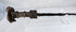 Side view of an ancient Iranian iron sword with a double-edged blade, ribbed handle, and naturally oxidized archaeological surface.