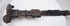 Close-up of the upper blade and hilt of a Luristan iron short sword, displaying corrosion and patina consistent with significant age.