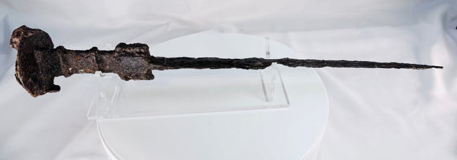 Ancient Luristan iron short sword from Western Iran dating to circa 750–650 BCE, shown in full with its straight blade and lion-head disc pommel.