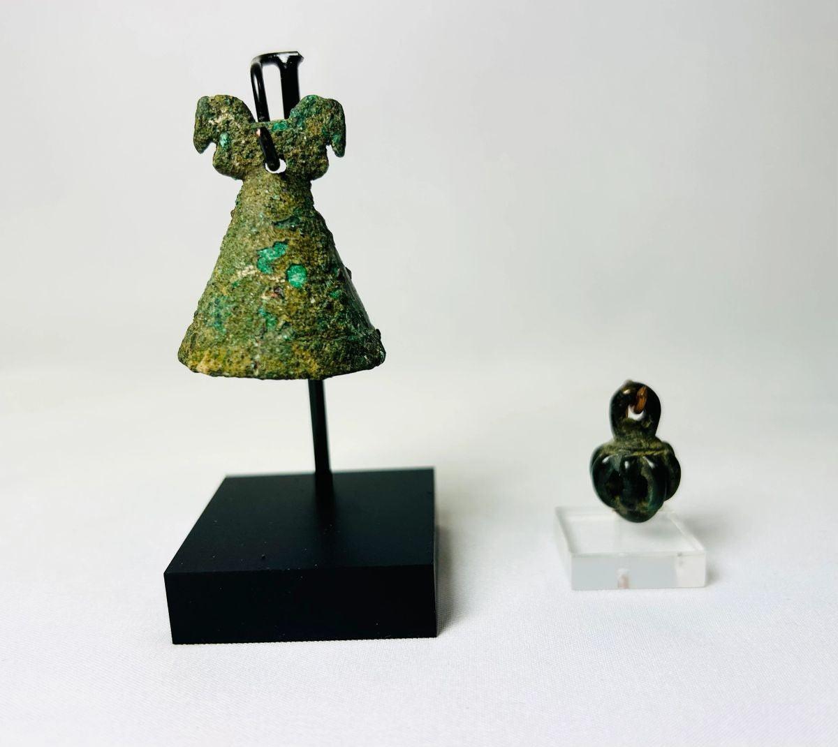 Ancient Luristan pendant bell from modern-day Lorestan, Iran, 1st Millennium BCE. Cast bronze/iron alloy openwork globe with seven bars and suspension loop, designed to contain rattle pellets. Iron Age ornament reflecting Luristan metalwork, ceremonial use, and symbolic protective function.