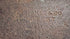 Close-up of the M.H. Jones & Co. maker’s mark stamped into the forged steel of the 19th-century axe head.