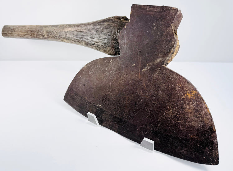 Front face of a 19th-century M.H. Jones & Co. broadhead axe displaying the broad cutting edge and natural iron patina.