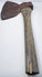 Historic American logging axe photographed from a low side angle, showing the steel head secured to its original wooden handle.