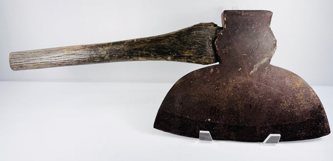 Detailed side angle of a 19th-century American broad axe showing the thick poll, blade construction, and wooden handle.