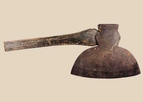 19th-century American broadhead axe with forged steel blade and flat reverse head, featuring a sturdy wooden handle, manufactured by M.H. Jones & Co., New York, used for woodcutting and frontier tasks.