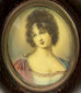 Close-up of gouache miniature painting of Madame Récamier in Empire gown under convex glass