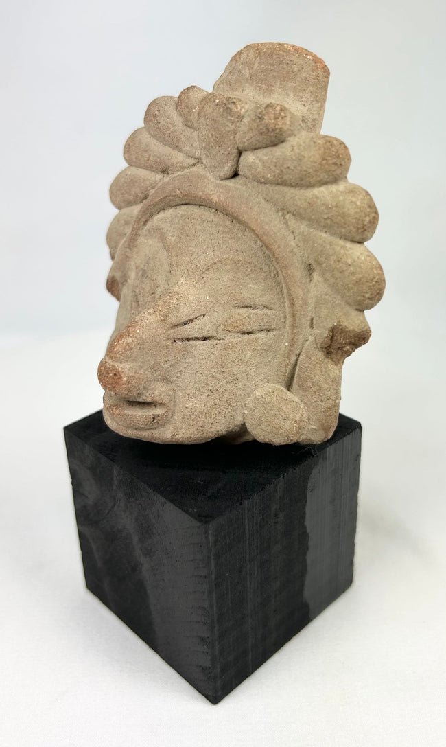 Ancient Javanese Majapahit guardian head, Kala Simha motif, carved volcanic andesite with stylized mane