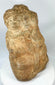 Side view of Majapahit three-faced Brahma stone sculpture, 14th–15th century Java, Indonesia, carved from volcanic andesite with natural patina and temple wear.