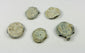 Five historic lead trade seals with marine patina and encrustation from prolonged underwater exposure