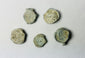 Shipwreck-recovered lead bag or bale seals with traces of impressed commercial markings