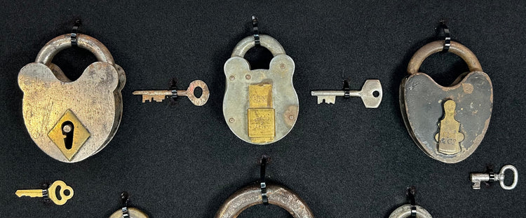 Vintage lock and key collection with U.S. marked and Old Glory padlocks