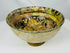 Seljuk period Islamic earthenware bowl with green glaze and black painted decoration
