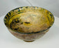 Islamic earthenware bowl from Persia or Syria with Kufic inspired rim design