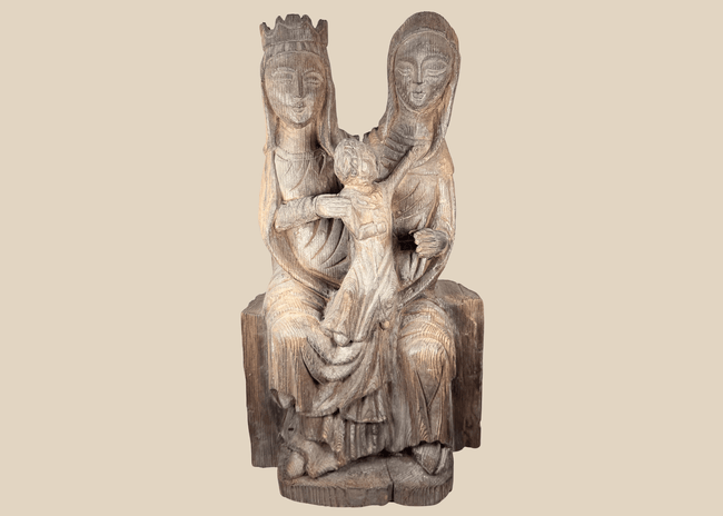 Hand-carved European wooden sculpture depicting the Virgin Mary, Saint Anne, and the Christ Child in Gothic Revival style