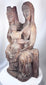 European religious wood carving with elongated Gothic facial features and flowing drapery
