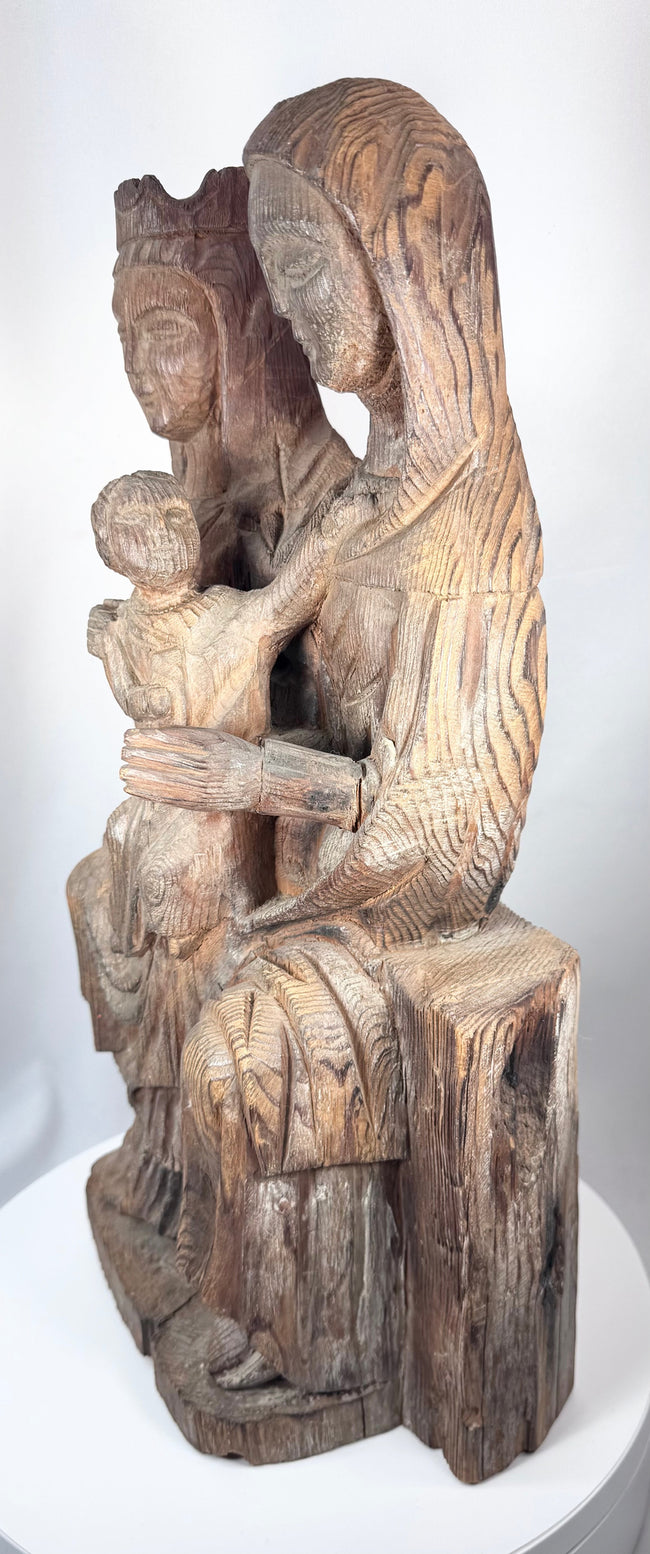 Antique devotional sculpture inspired by medieval Romanesque and Gothic church carvings