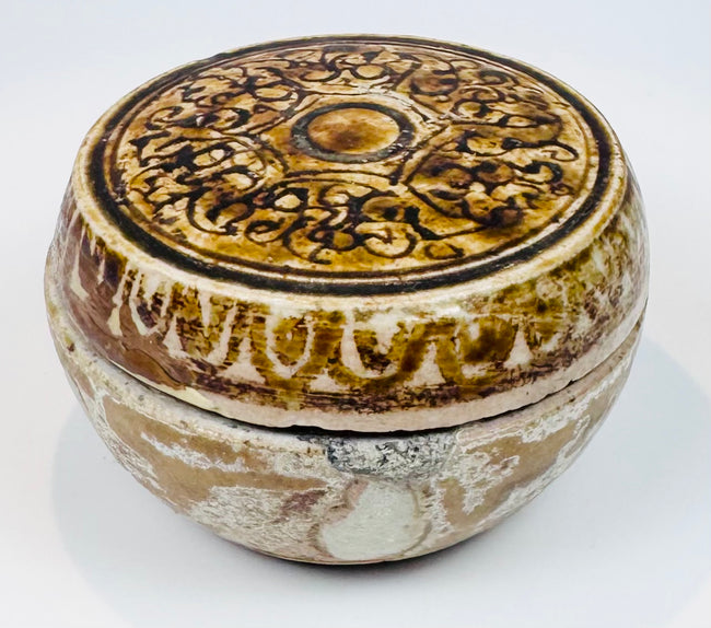 Sawankhalok stoneware box displaying extensive glaze loss and archaeological wear
