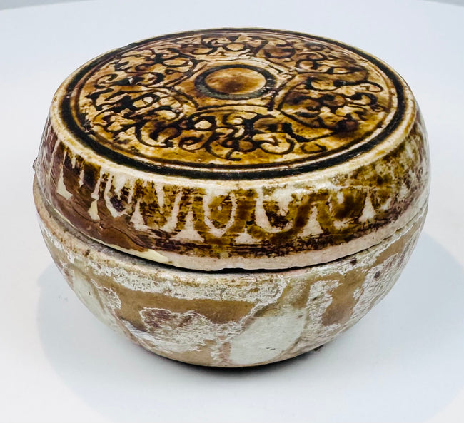 Front view of a 15th-century Sawankhalok stoneware covered box from Thailand