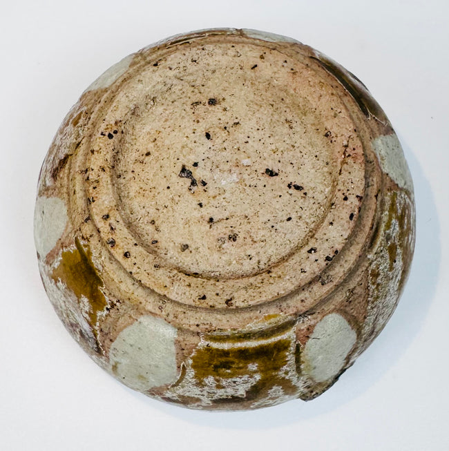Overhead view of the Sawankhalok box lid with symmetrical foliate motifs