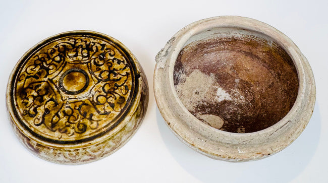 Interior view of the Thai covered box showing its brownish glaze and unglazed rim