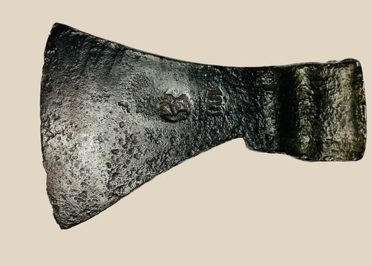 Medieval forged iron axe head, 12th–15th century CE, with curved blade for chopping, flat poll for hammering, and visible etched markings; weathered patina and surface pitting from centuries of use.