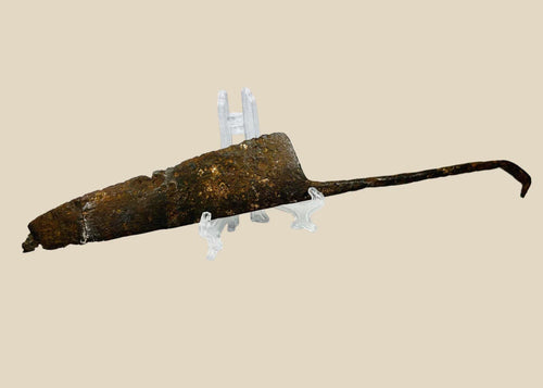 Excavated medieval European long knife, circa 12th–15th century CE, forged from iron/steel. Wide single-edged blade with tapered point, full-length tang with curved end, showing patina and surface aging. Functional weapon and utility tool reflecting High to Late Middle Ages craftsmanship and daily life.