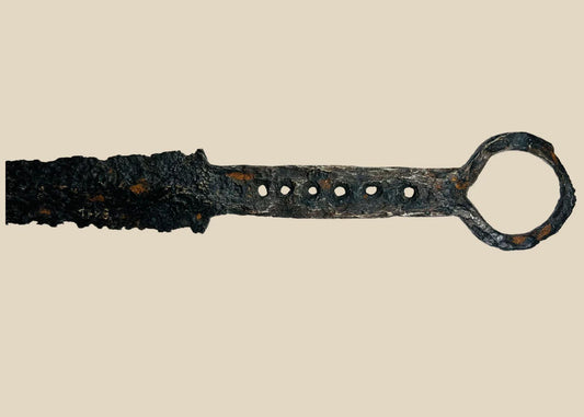 14th-century medieval European quillon dagger with tapered blade, crossguard, and ring pommel, forged steel and iron construction with aged patina.