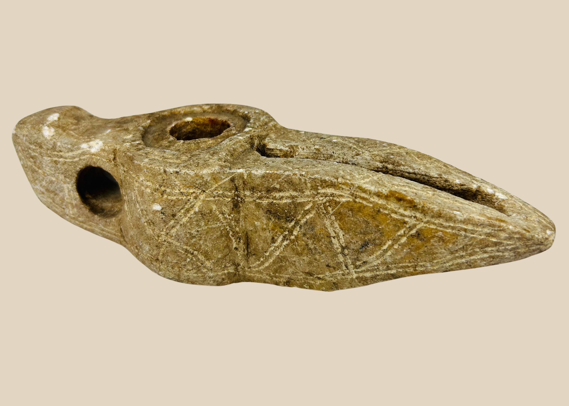 Ancient Islamic carved stone oil lamp with geometric decoration