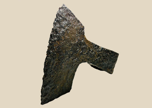 Ancient medieval iron axe head with broad bearded blade and hollow socket, Viking and early European design, circa 10th–14th century CE.