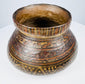 Detailed view of geometric decoration on Mesoamerican polychrome pottery bowl, including stepped and zigzag motifs