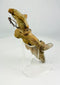 Rear view highlighting hand-modeled construction of a Mesoamerican terracotta figure