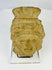Pre-Columbian terracotta head fragment, circa 1st millennium CE, with stylized facial features and ornate fan-like headdress, weathered patina.