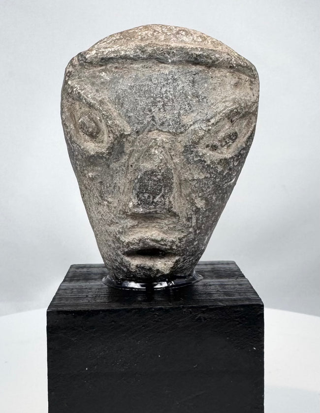 Ancient Near Eastern terracotta head with prominent almond-shaped eyes