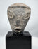Ancient Near Eastern terracotta head with prominent almond-shaped eyes