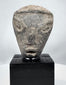 Ancient Near Eastern terracotta head with prominent almond-shaped eyes