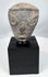 Mesopotamian pottery fragment with geometric facial features and angular brows