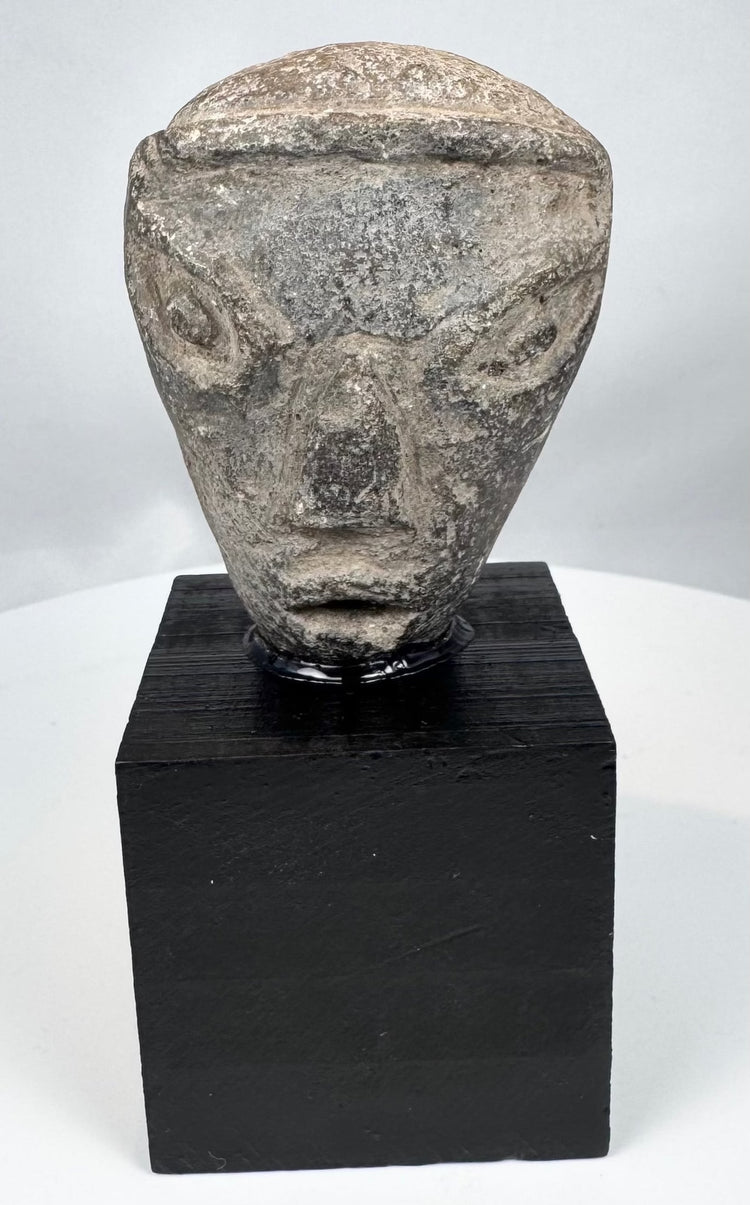Mesopotamian pottery fragment with geometric facial features and angular brows